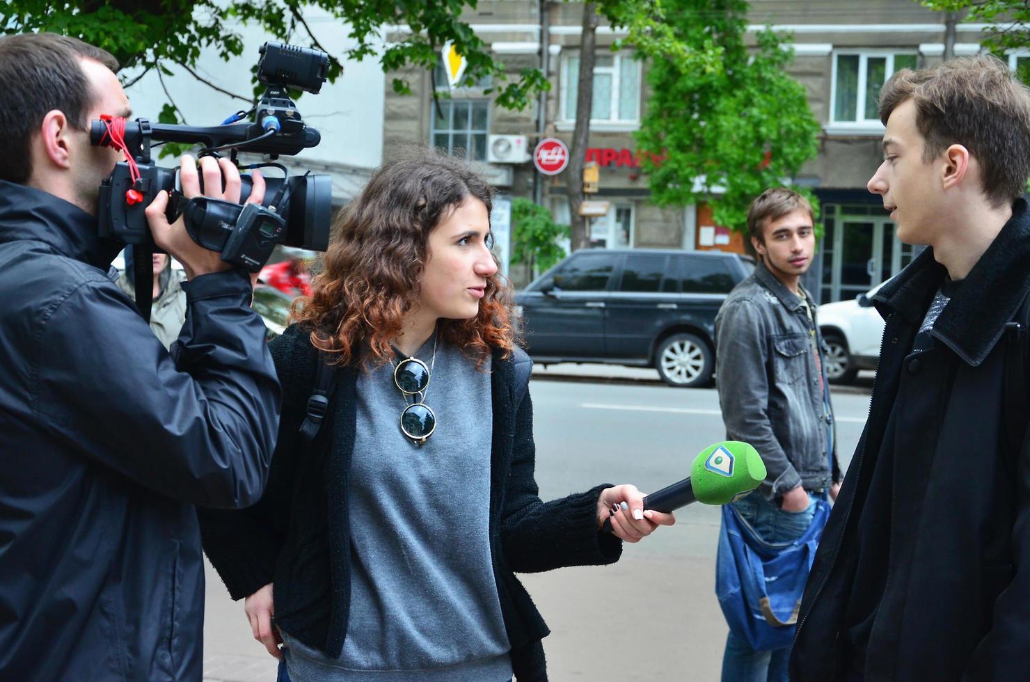 KHARKOV. UKRAINE - MAY 17, 2022 Participants of the first LGBT action in Kharkov give interviews about an unexpected attack and disruption of the event photo