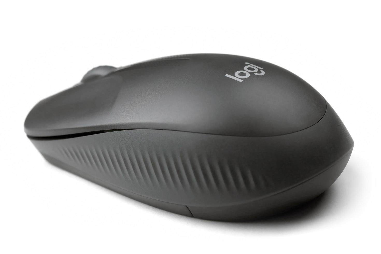 KHARKIV, UKRAINE - MARCH 5, 2022 Logitech wireless mouse on white background. Logitech is a Swiss multinational manufacturer of computer peripherals photo