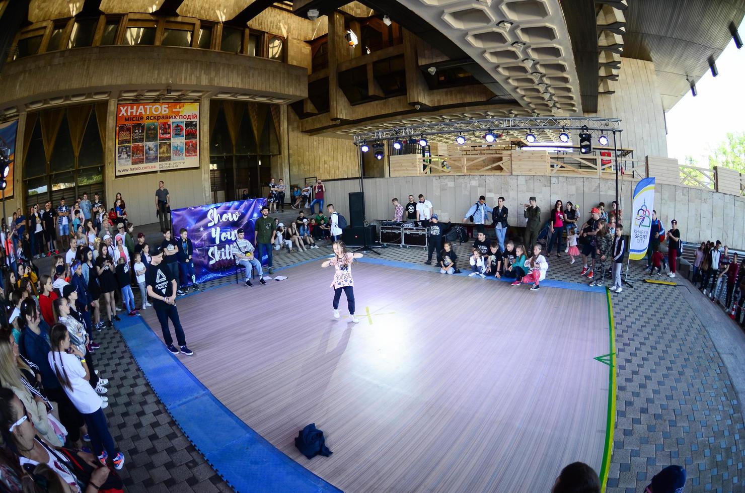 KHARKIV, UKRAINE - 27 MAY, 2022 Dance battle on the festival of street cultures. Break dance and hip-hop children and teenagers photo