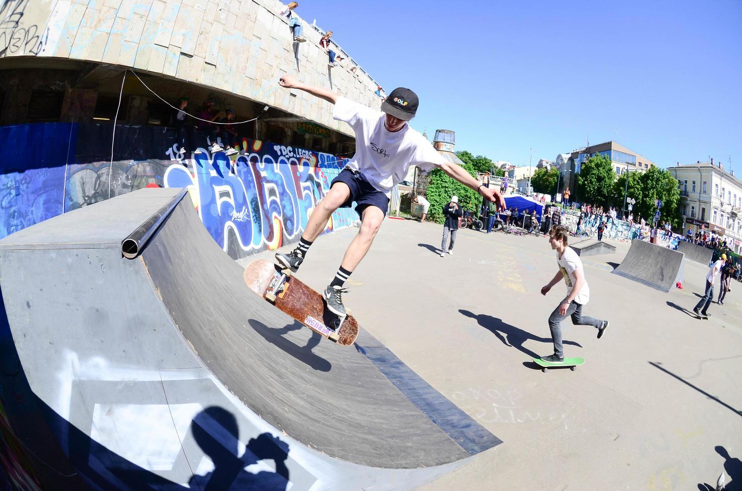 KHARKOV. UKRAINE - MAY 2, 2022 Skateboarding contest in outdoors skate park during the annual festival of street cultures photo