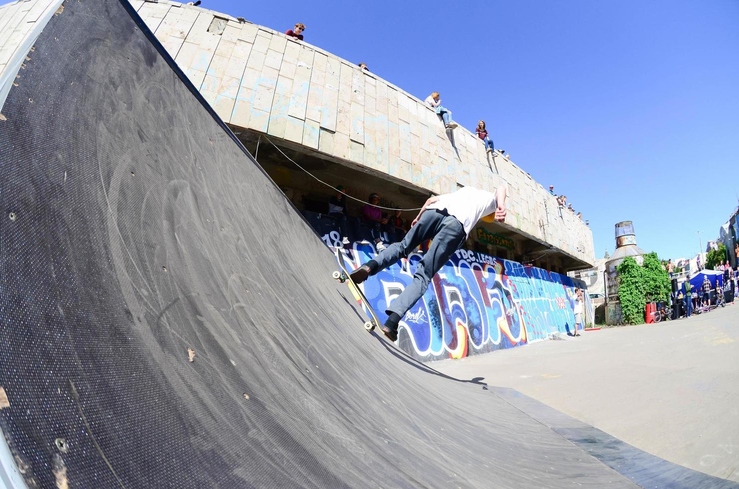 KHARKIV, UKRAINE - 27 MAY, 2022 Skateboarding contest in outdoors skate park during the annual festival of street cultures photo