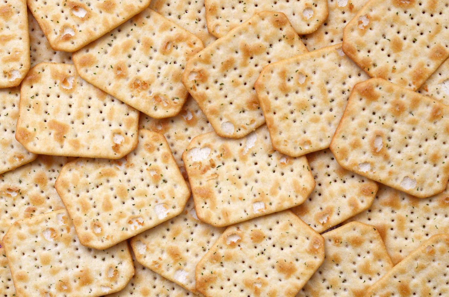 KHARKOV. UKRAINE - MAY 2, 2022 Tuc Original Snack Crackers lies on market table stacked in big pile photo