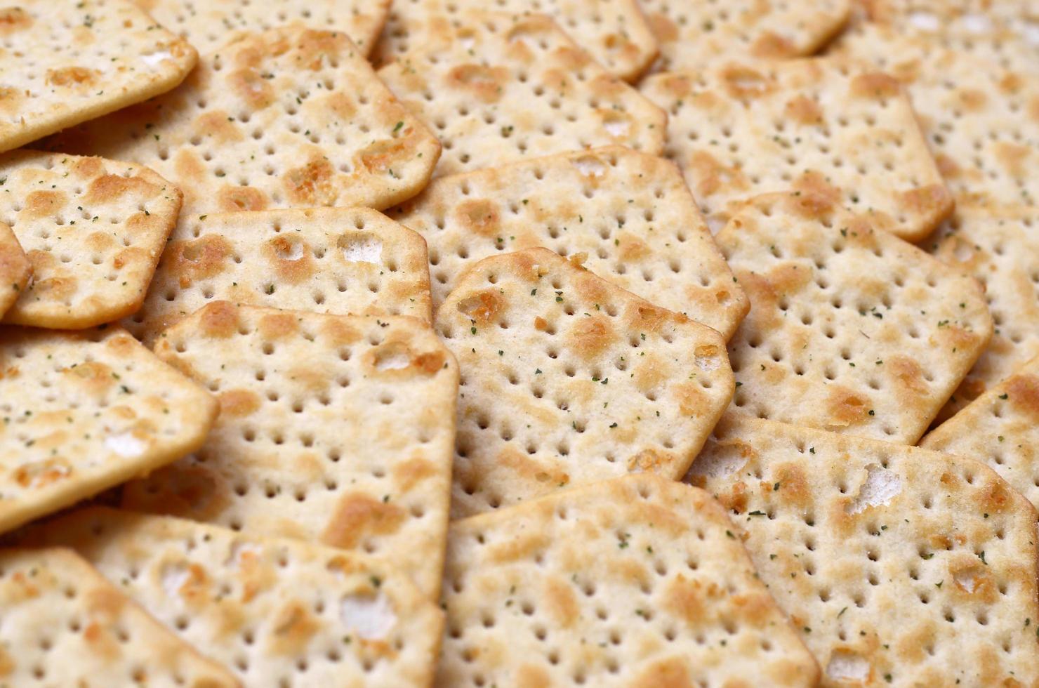 KHARKOV. UKRAINE - MAY 2, 2022 Tuc Original Snack Crackers lies on market table stacked in big pile photo