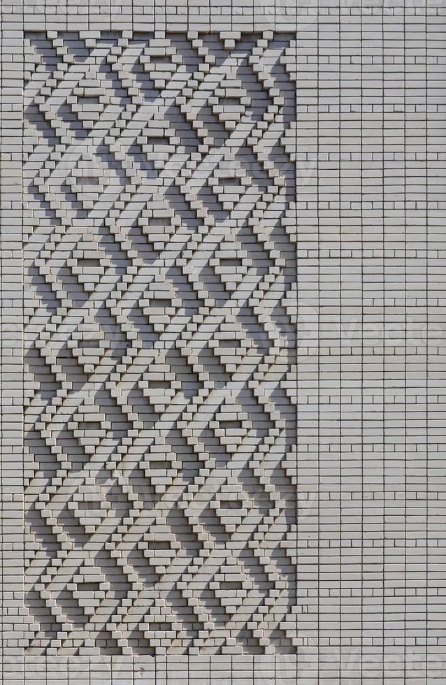 A pattern made of white bricks in the form of diamond shapes. Decoration of the walls during the Soviet Union photo