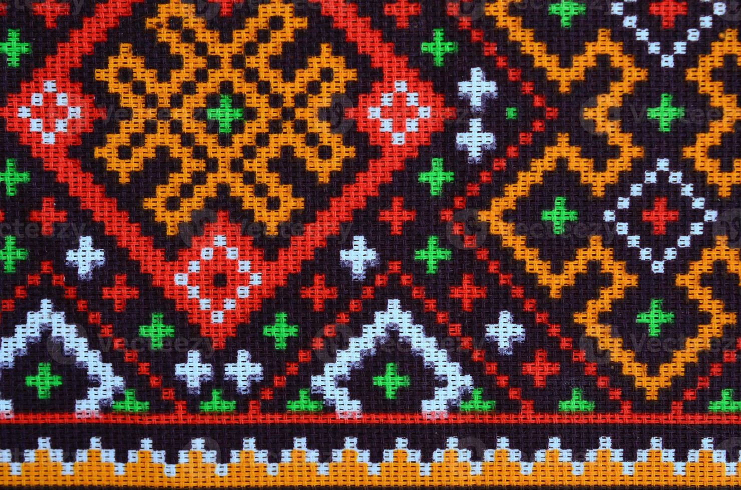 Traditional Ukrainian folk art knitted embroidery pattern on textile fabric photo