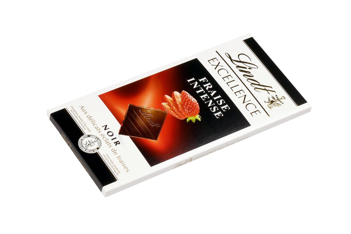 KHARKIV, UKRAINE - DECEMBER 18, 2022 Lindt Chocolate on white background. Lindt and Spruengli AG is a Swiss chocolatier and confectionery company known for their chocolate bars photo