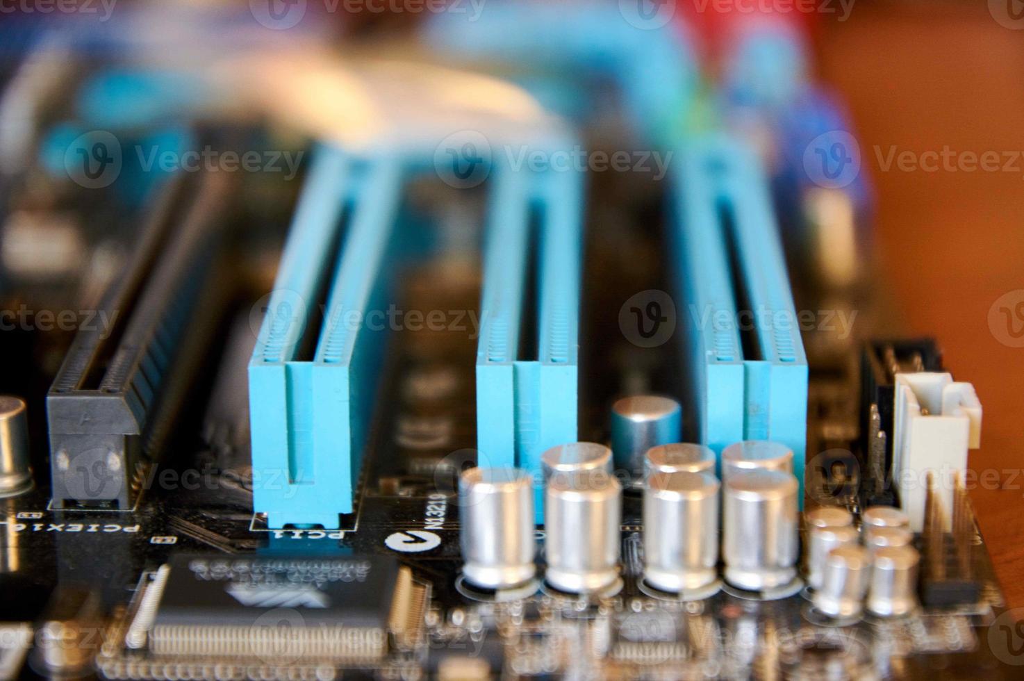 motherboard IEEE 1394a audio codec and controller chips, PCI slots and PCI-e x1 slots closeup photo