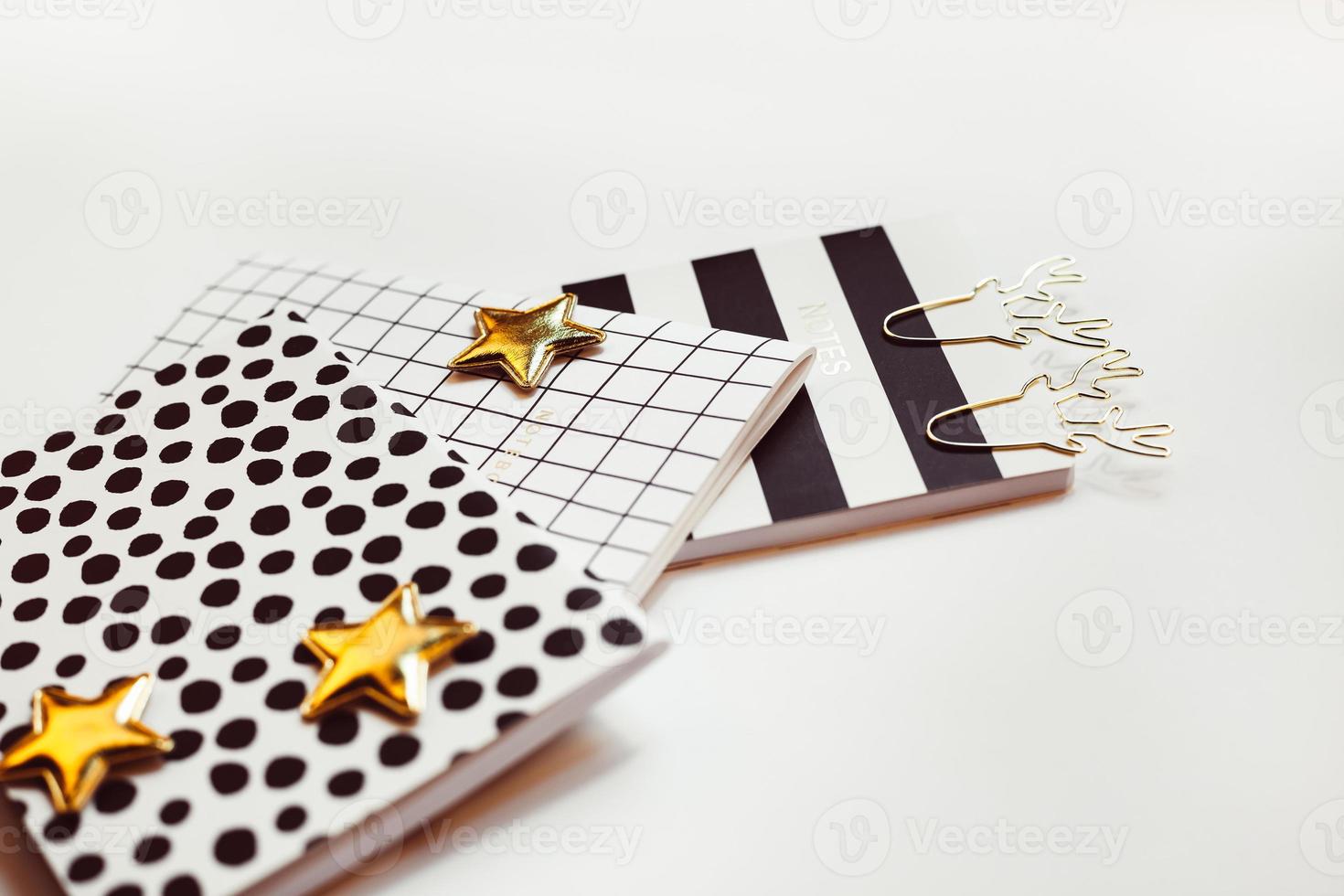 Desktop feminine composition. Notepads and stars photo