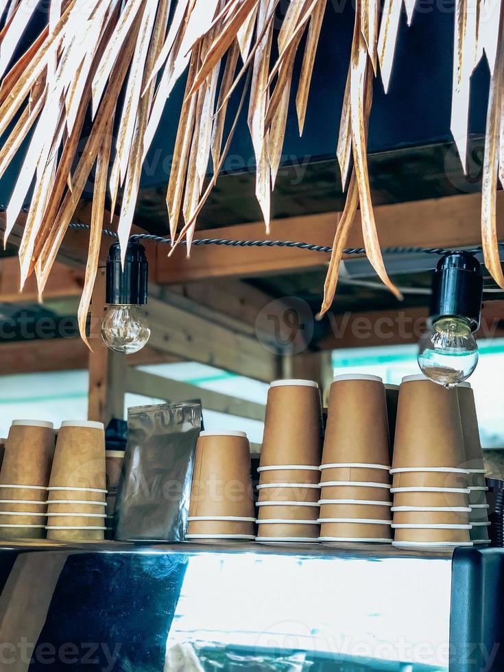 Disposable coffee cups in street market cafe photo