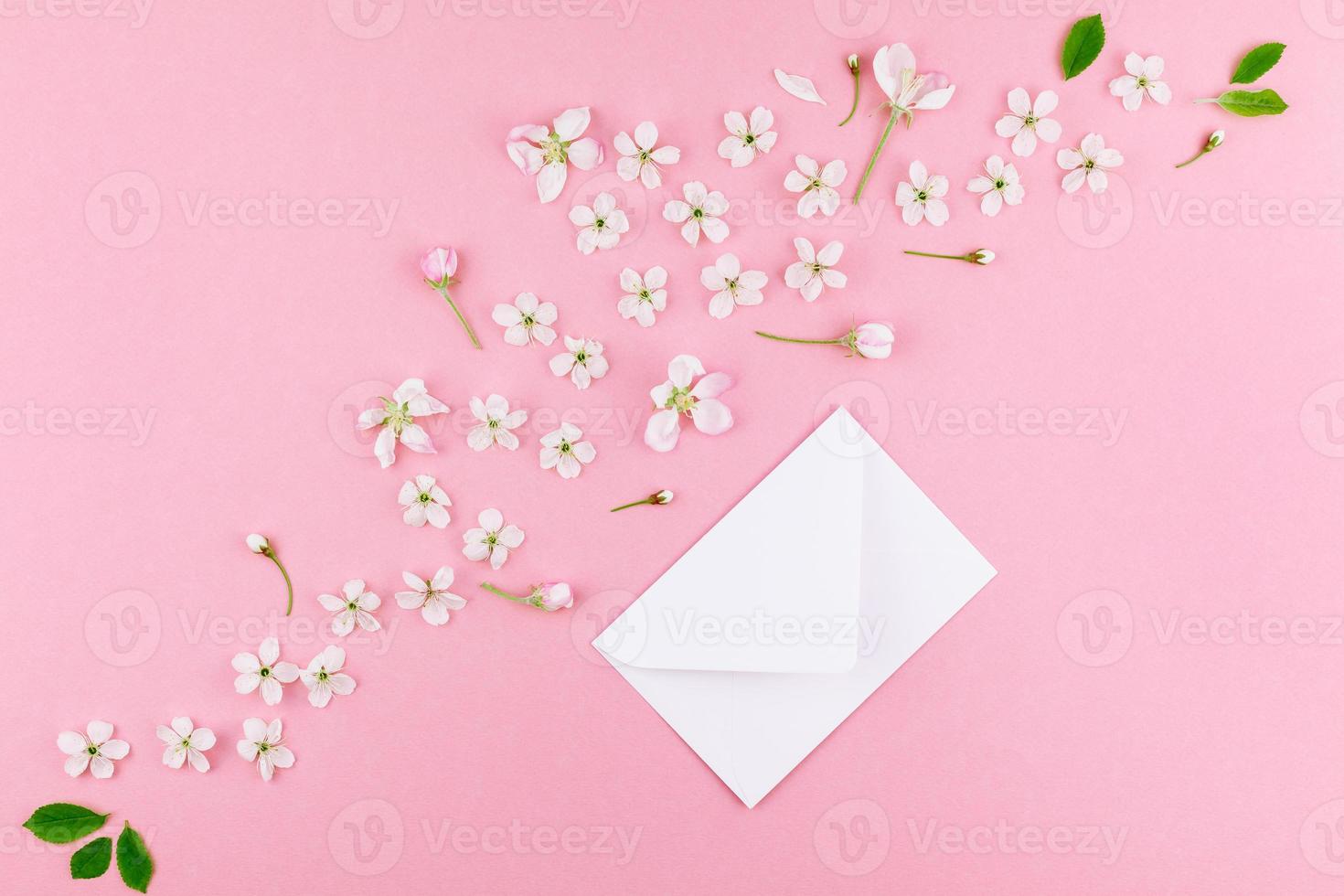 Concept of love letter with envelope and flowers photo