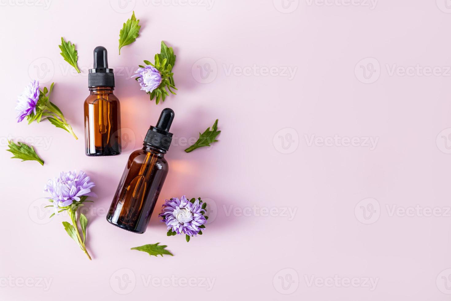 two glass bottles with cosmetic or serum for facial skin care. the effect of deep moisturizing and nourishing the skin. top view. a copy space. photo