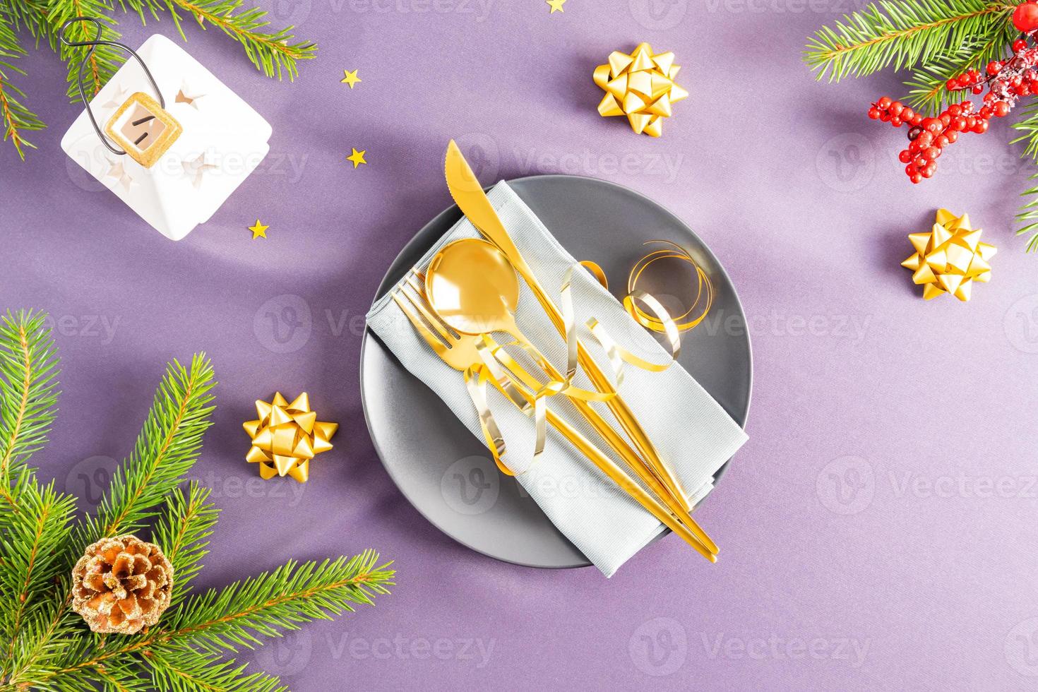 top view of the winter festive table with serving in the classic style of celebrating the New Year. Christmas decorations . dark background. photo