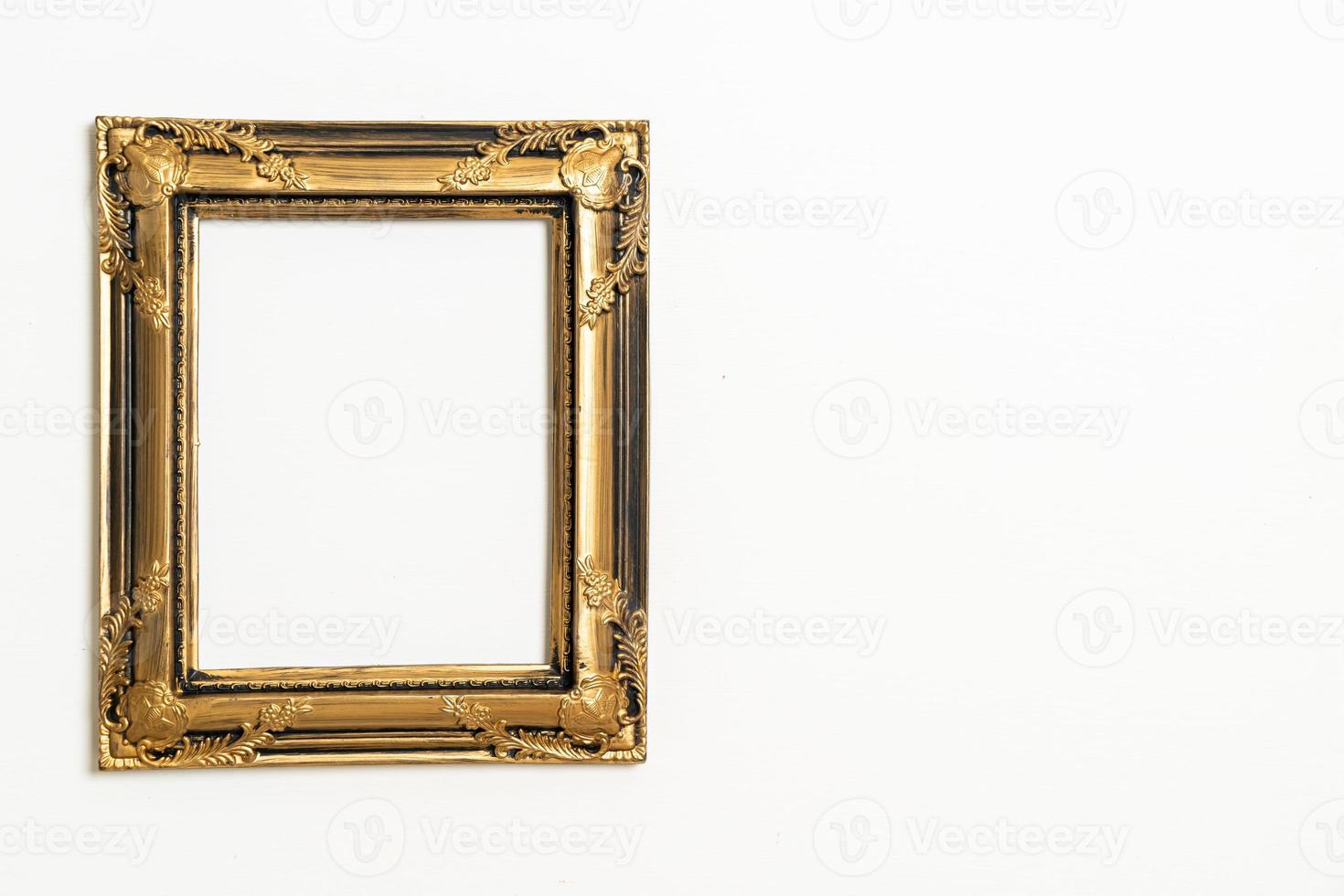 empty picture frame on white wall background photo