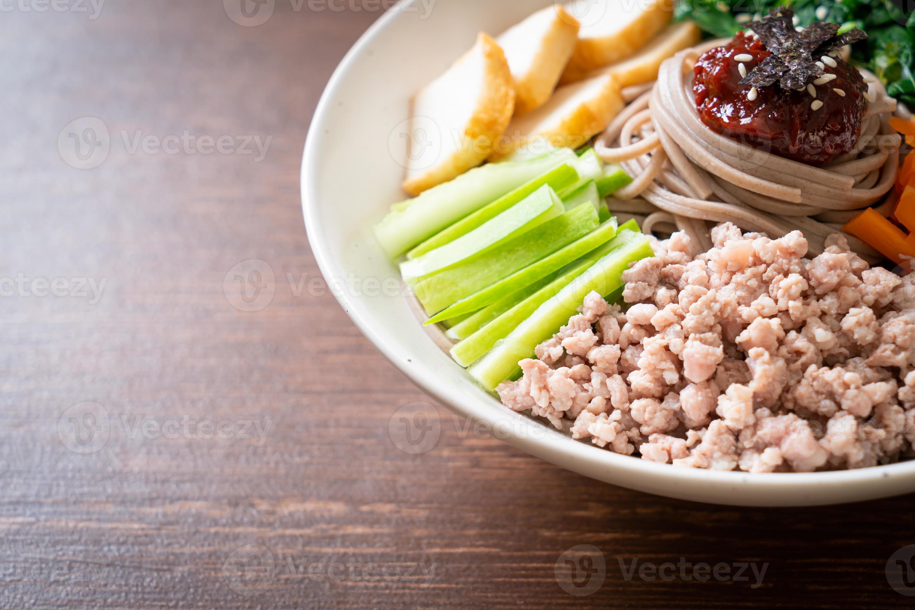 Korean spicy cold noodles 13941815 Stock Photo at Vecteezy