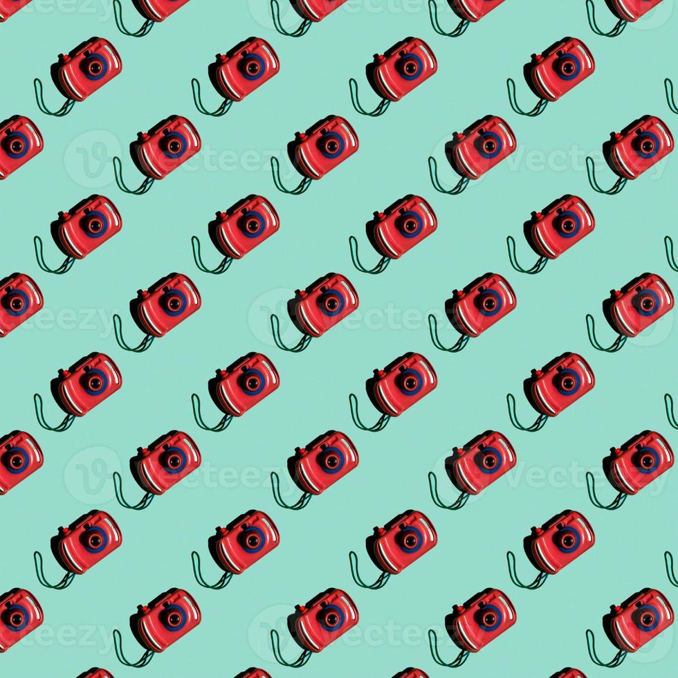 A pattern from a toy camera on a turquoise background. Top view photo