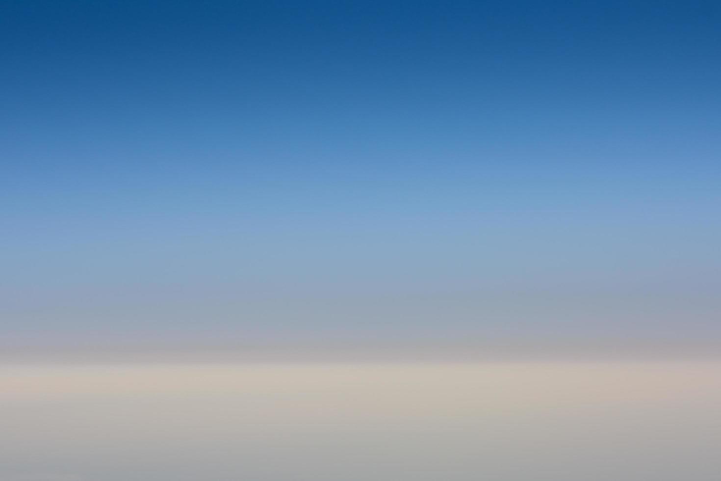 blue sky and soft white clouds during a flight on vacation photo