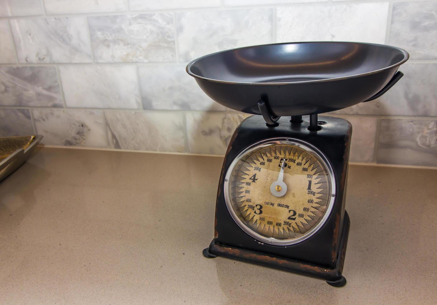 Antique Food Scale On Kitchen Counter photo