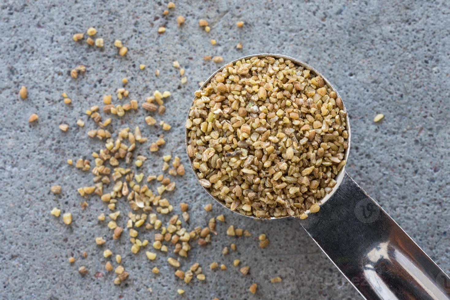 Anise Seeds Spilled from a Teaspoon photo