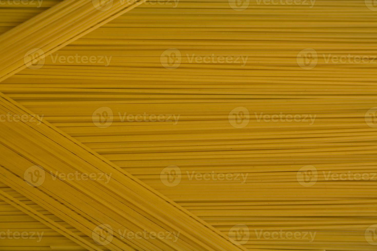 Spaghetti pasta Italian cuisine food. Yellow long spaghetti food background photo