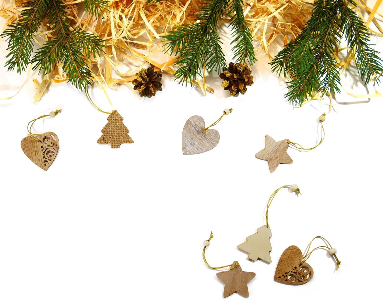 New Year Design on a white background. Decorations made of natural materials fir, cones, wooden shavings, Christmas toy photo