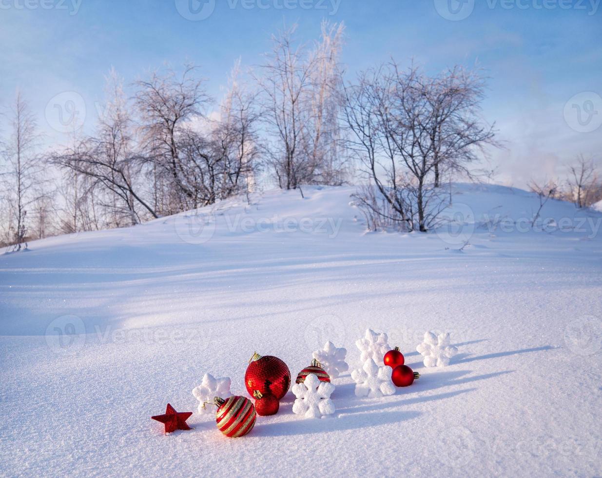 bright trinkets, Christmas balls, snowflakes and stars in the snow. christmas decorations photo