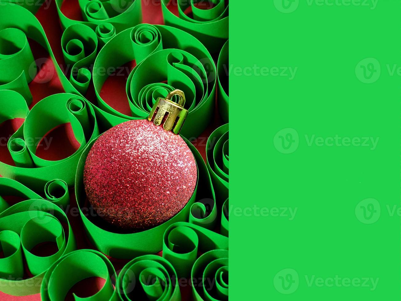 New year's background, Christmas decorations. Christmas ball on the background of a paper pattern photo