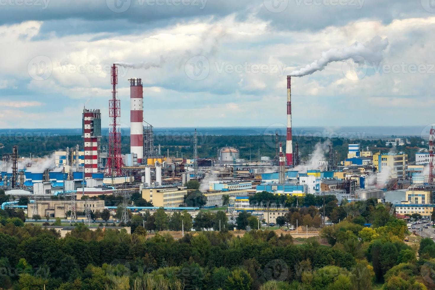 aerial panoramic view on smoke of pipes of chemical enterprise plant. Industrial landscape environmental pollution waste plant. Air pollution concept. photo