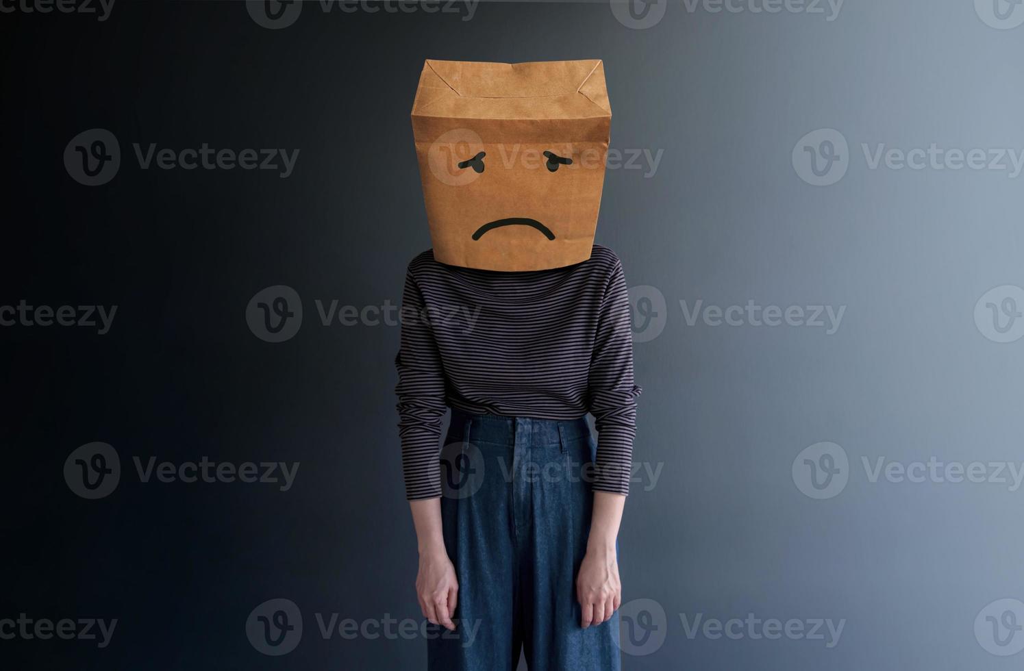 Customer Experience or Human Emotional Concept. Woman Covered her Face by Paper Bag and present Sad Feeling by Drawn Line Cartoon and Body Language photo