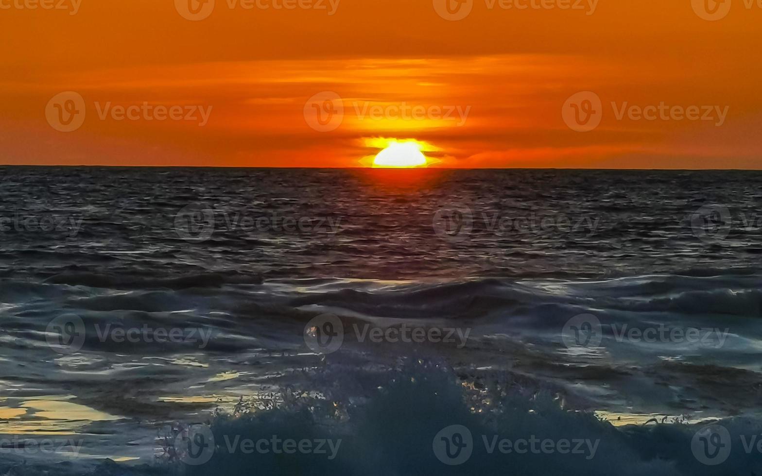 Colorful golden sunset big wave and beach Puerto Escondido Mexico. photo