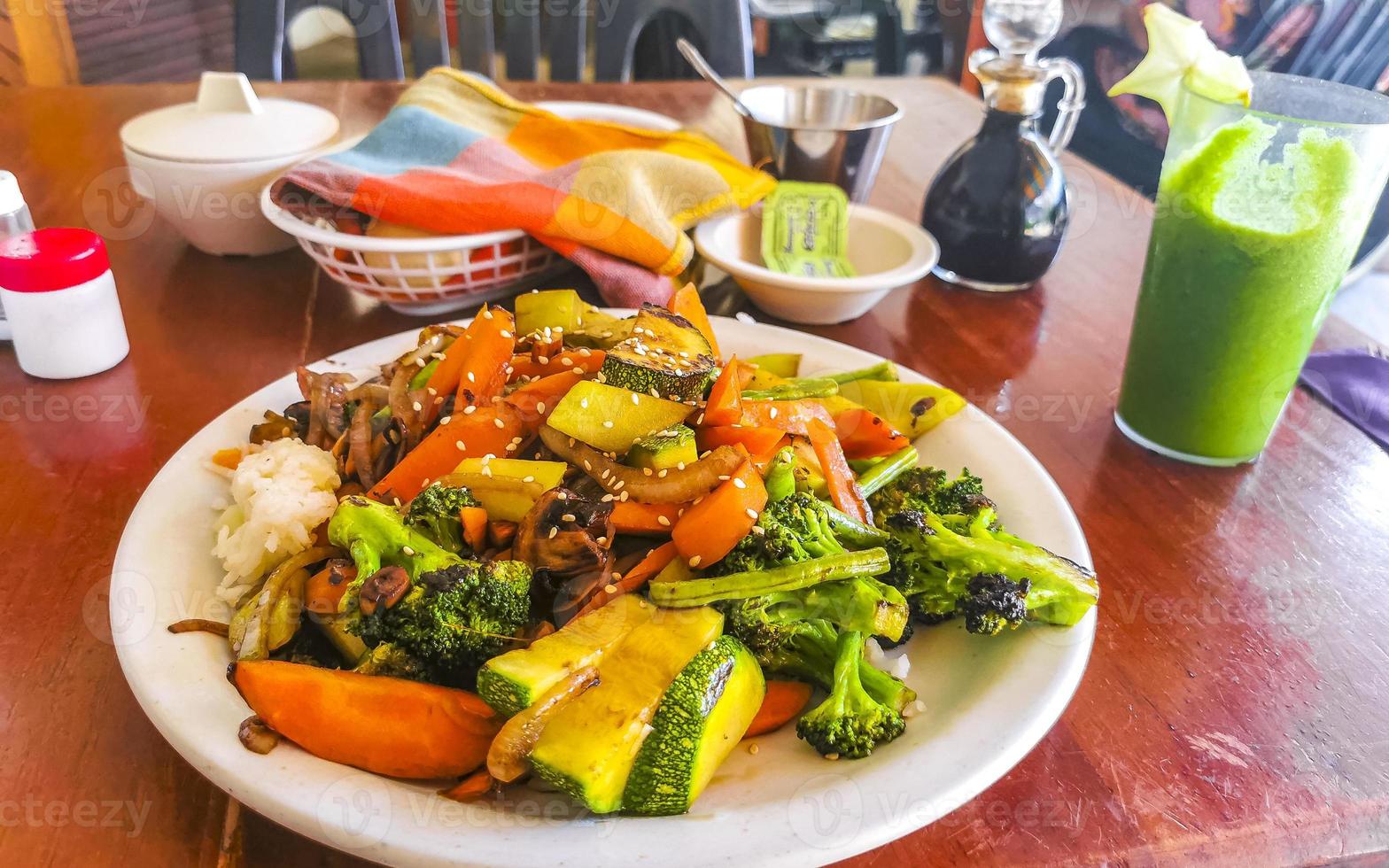 Fried rice and vegetables on white plate Puerto Escondido Mexico. photo