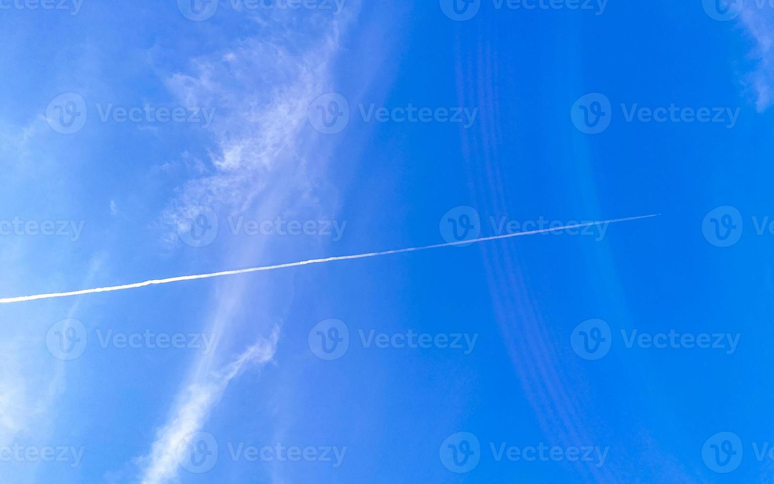 Blue sky with chemical clouds chemical sky chemtrails chemtrail. photo