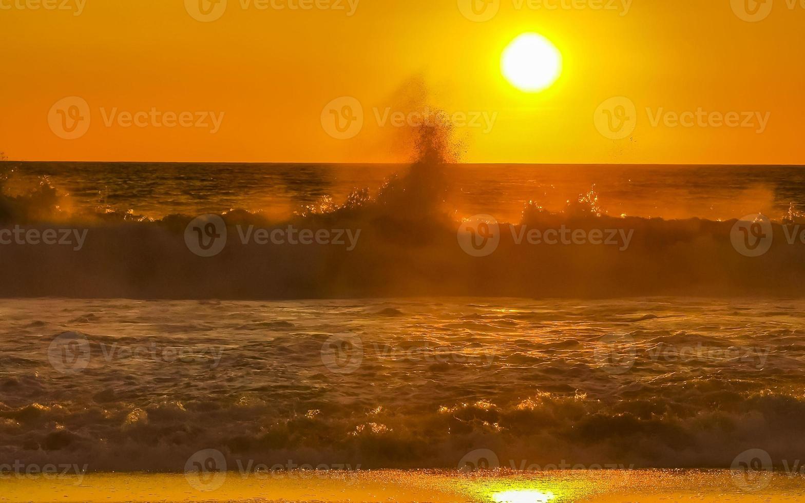 Colorful golden sunset big wave and beach Puerto Escondido Mexico. photo