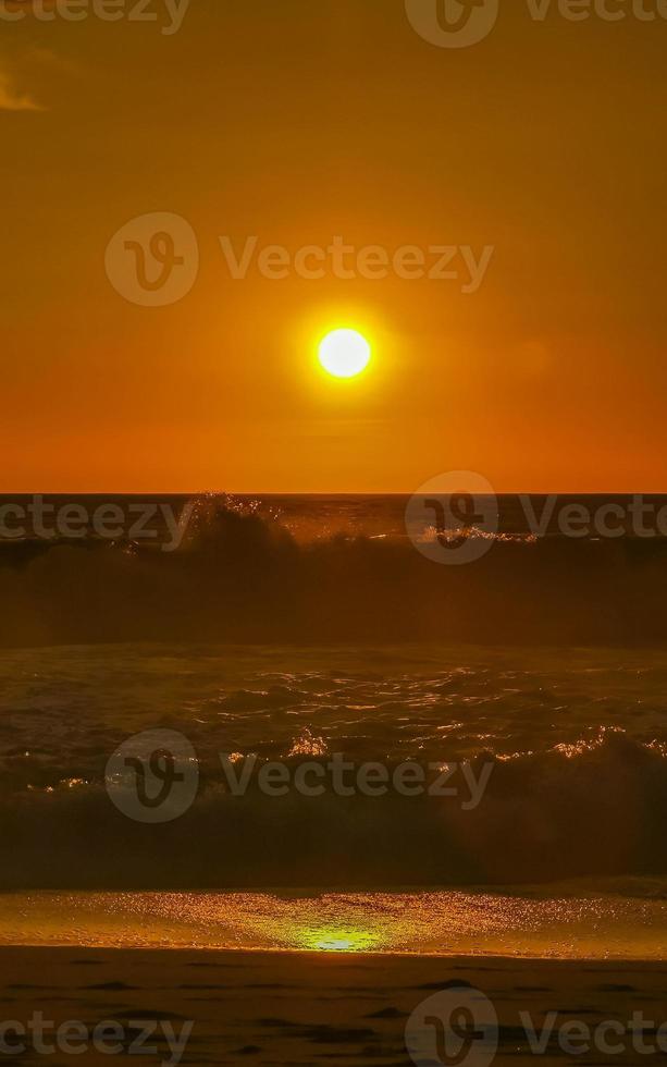 Colorful golden sunset big wave and beach Puerto Escondido Mexico. photo