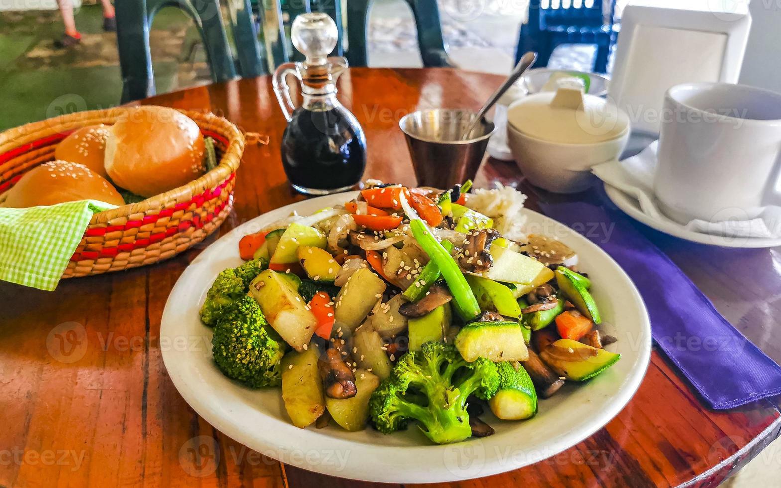 Fried rice and vegetables on white plate Puerto Escondido Mexico. photo