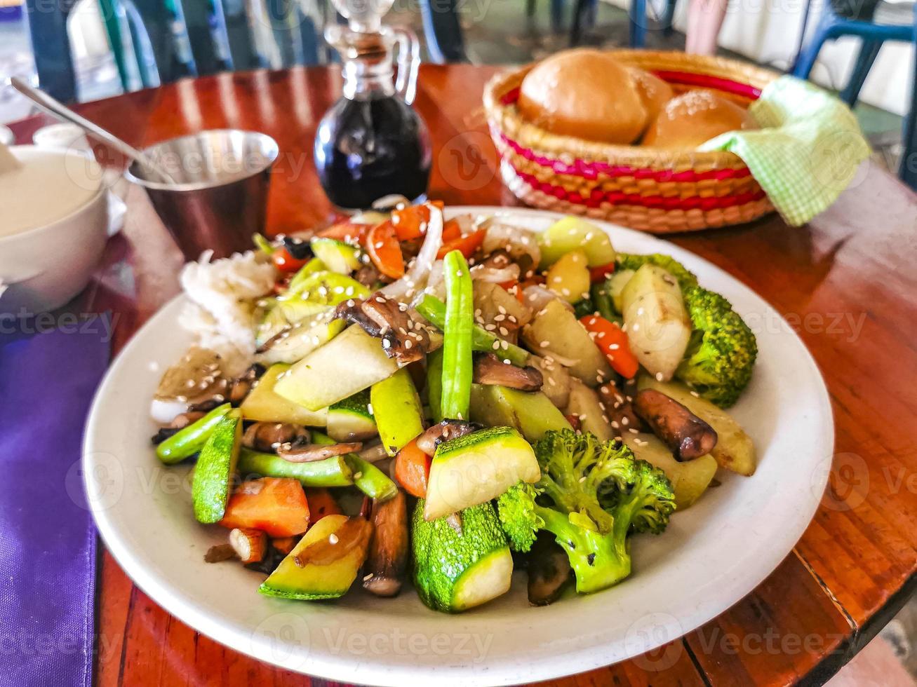 Fried rice and vegetables on white plate Puerto Escondido Mexico. photo