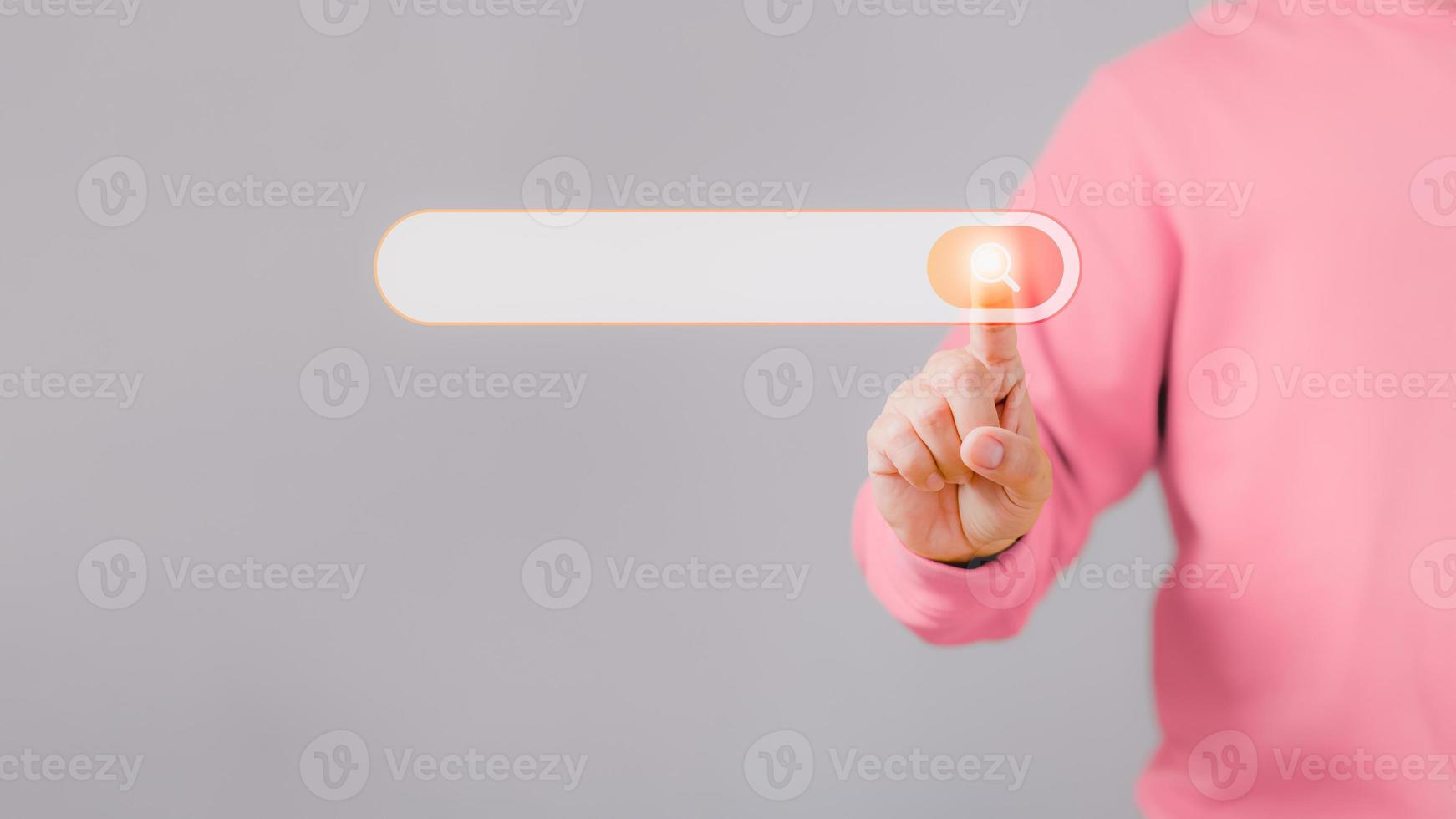 Man hand presses the information search button on computer touch screen. Technology, searching system and internet concept, copy space. photo