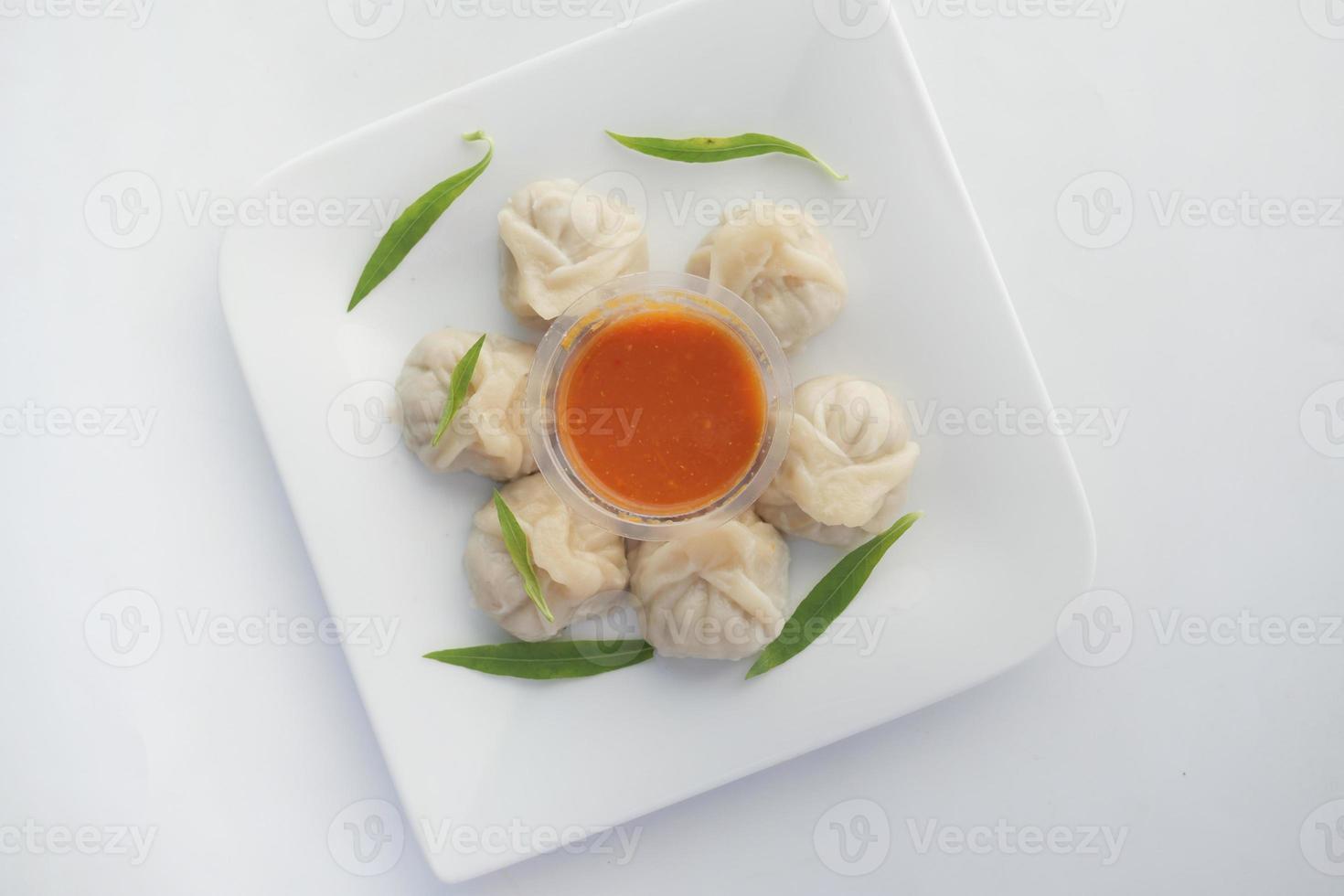 top view of chicken momo dumpling on a plate photo