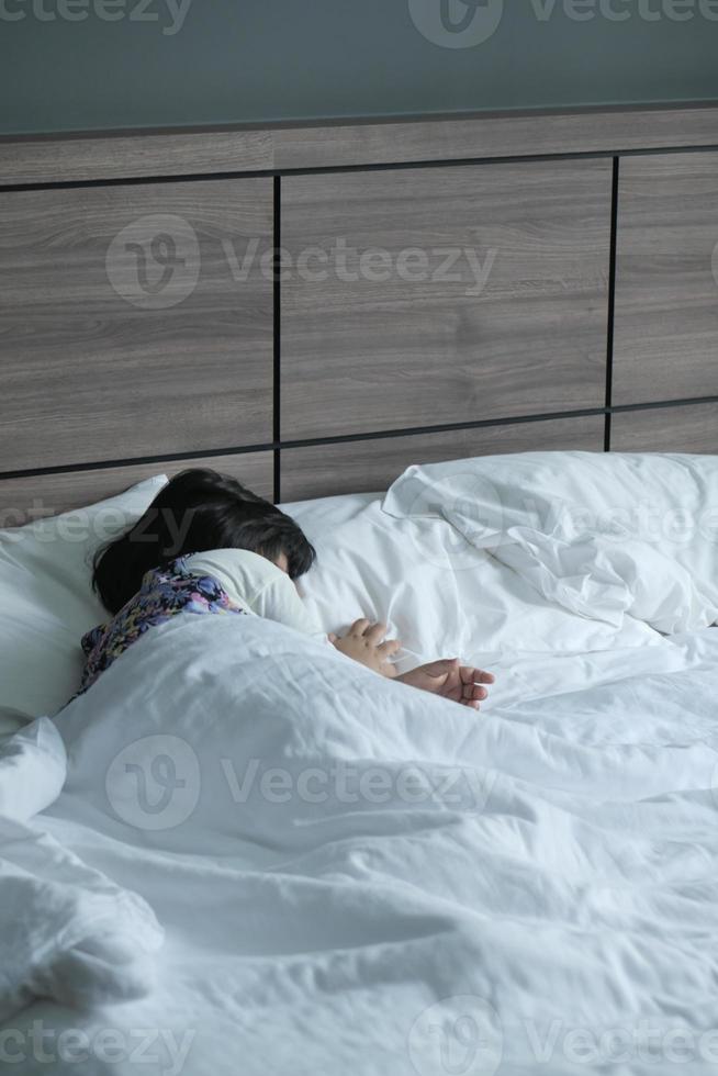 4 year old child girl sleeping on bed photo