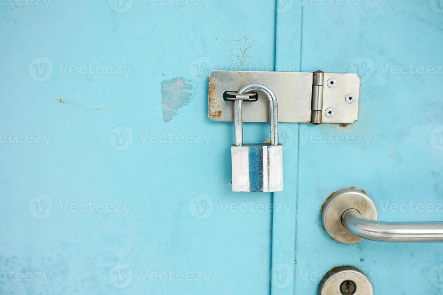 date door was locked with padlocks and chains photo