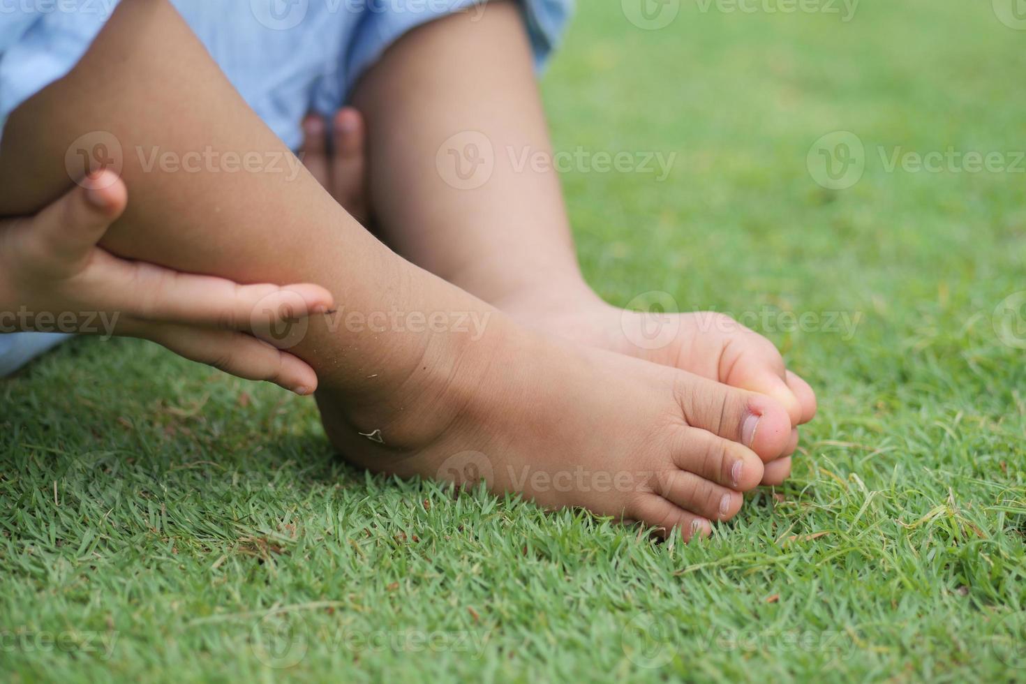 child girl suffering from itching skin, close up. photo