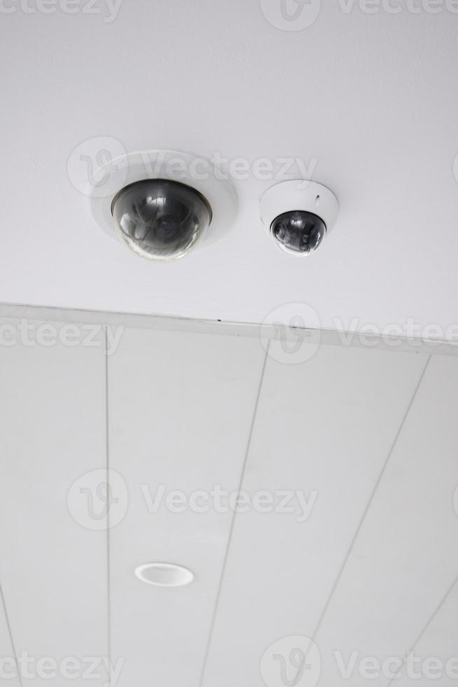 CCTV security camera operating outdoor photo