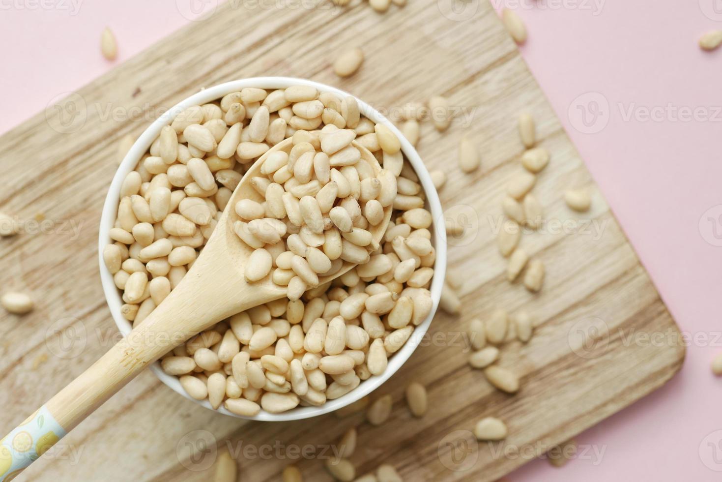 overhead view of pine nuts in a bowl photo