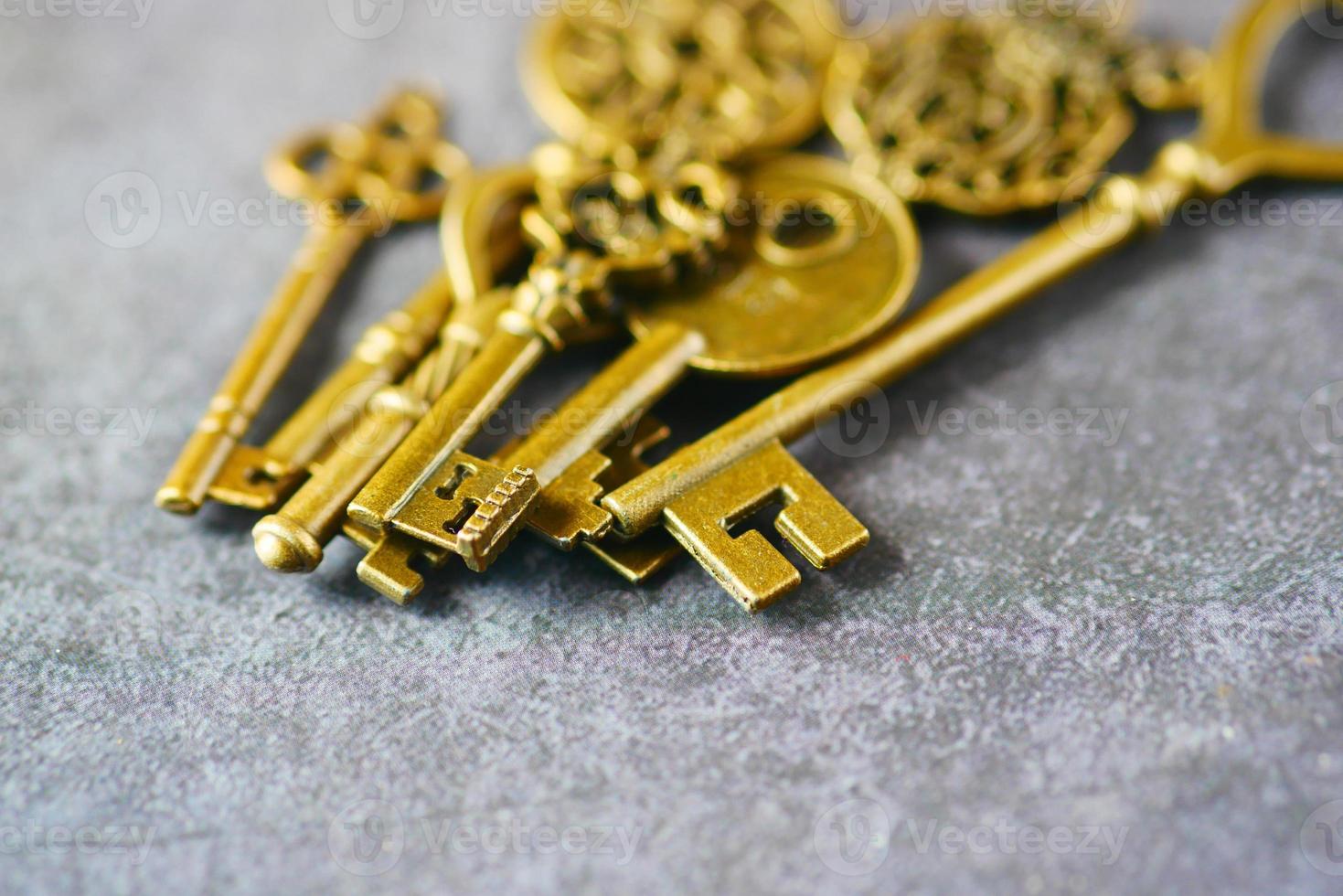 many old keys on table close up photo