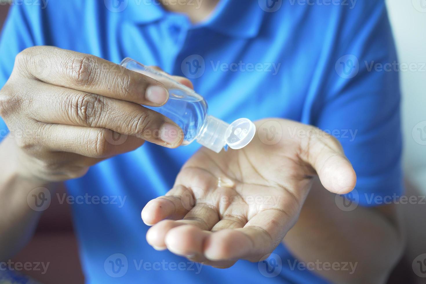 Using sanitizer liquid for preventing corona virus photo