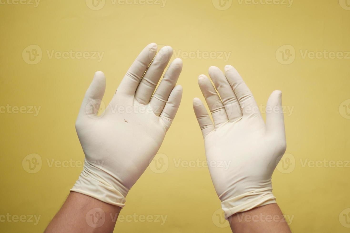 man doctor wears medical gloves, close up photo