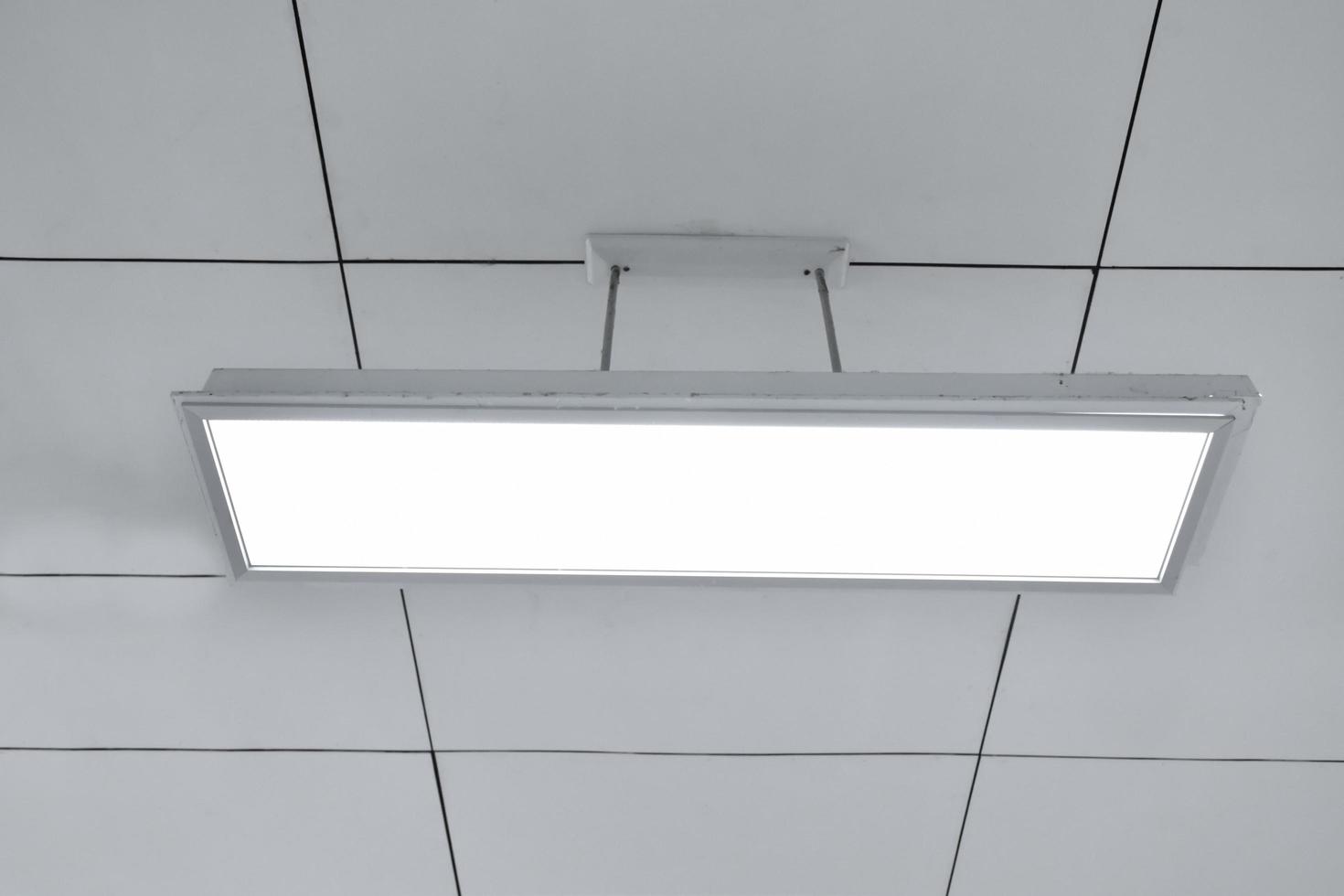 Ceiling lamp installed on the ceiling of the classroom, soft focus. photo