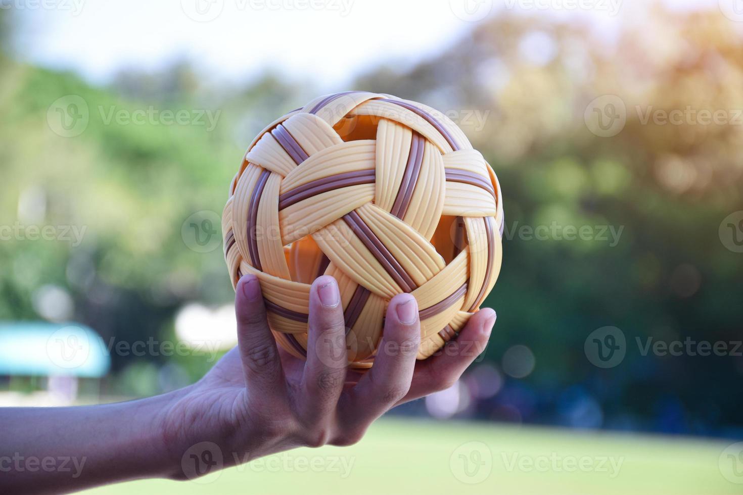 Sepak takraw ball, popular sport of southeast asian countries, soft and  selective focus, outdoor sport and recreational activity concept. photo