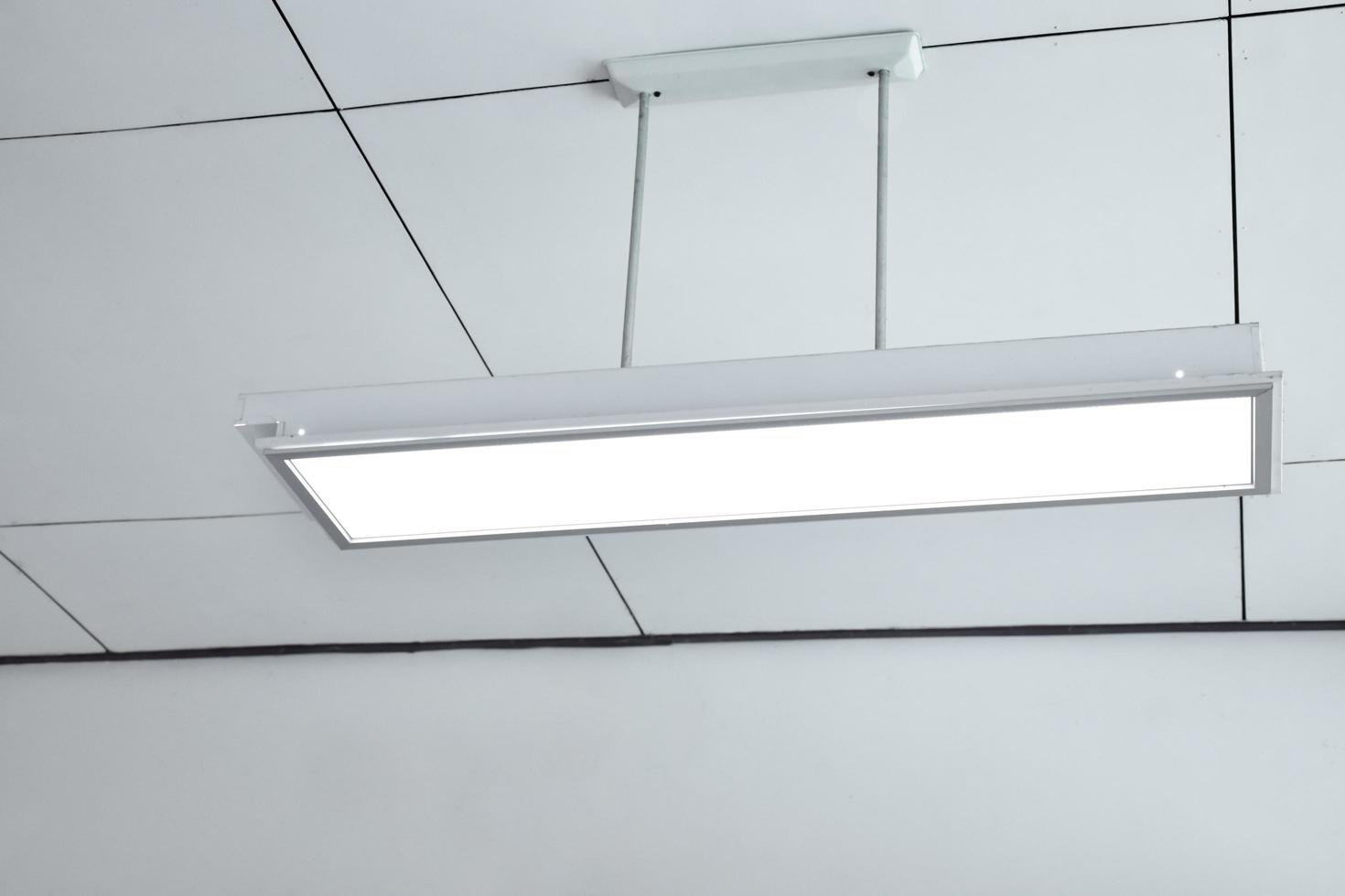 Ceiling lamp installed on the ceiling of the classroom, soft focus. photo