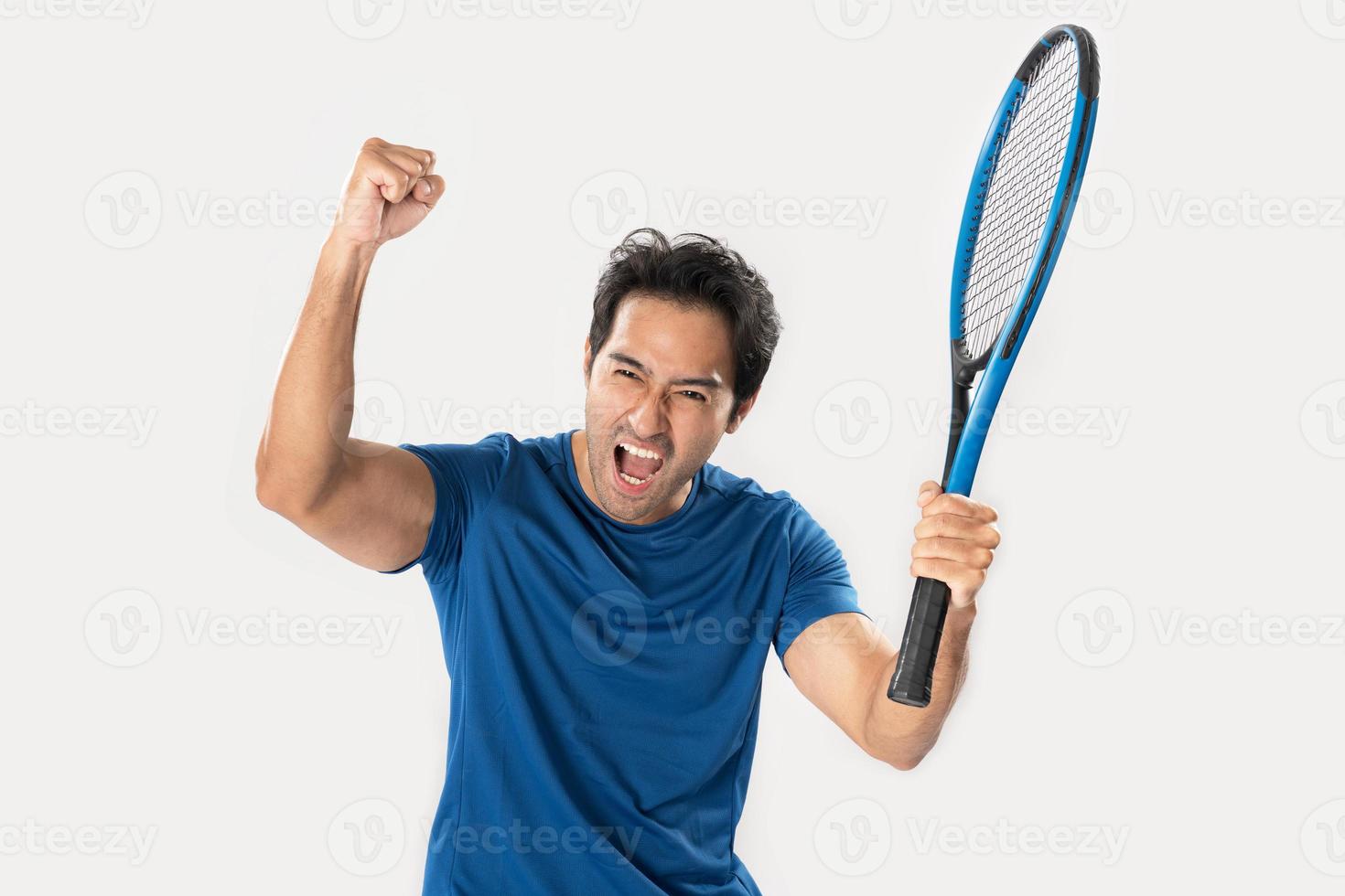 Happy male tennis player rejoicing at success. photo