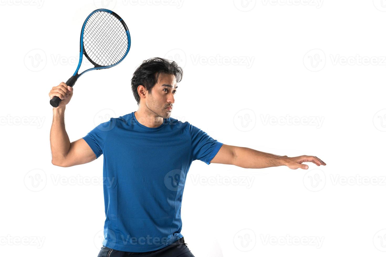 Male tennis player playing tennis with striving for victory gesture. photo